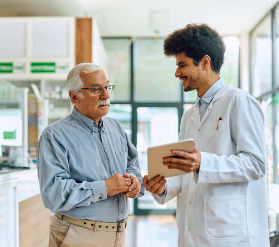 Pharmacist Career Guides Two pharmacists standing in a pharmacy with career planning resources and pathways in the pharmaceutical field